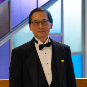 Portrait of Ron Cheung wearing a tuxedo